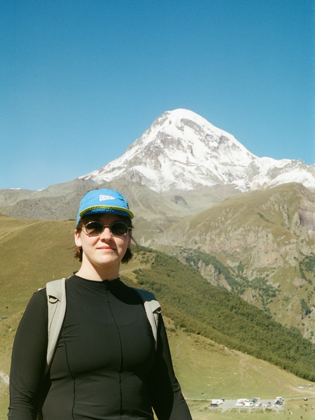 Woman at the mountain moving forward with peace and confidence