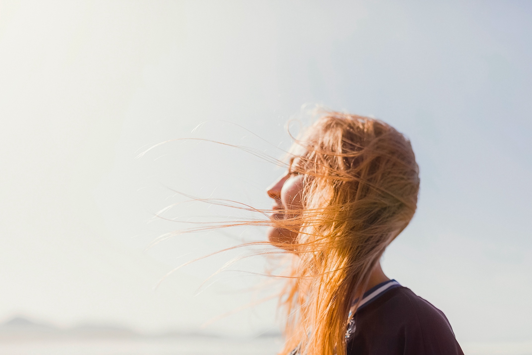 Woman eyes closed smiling