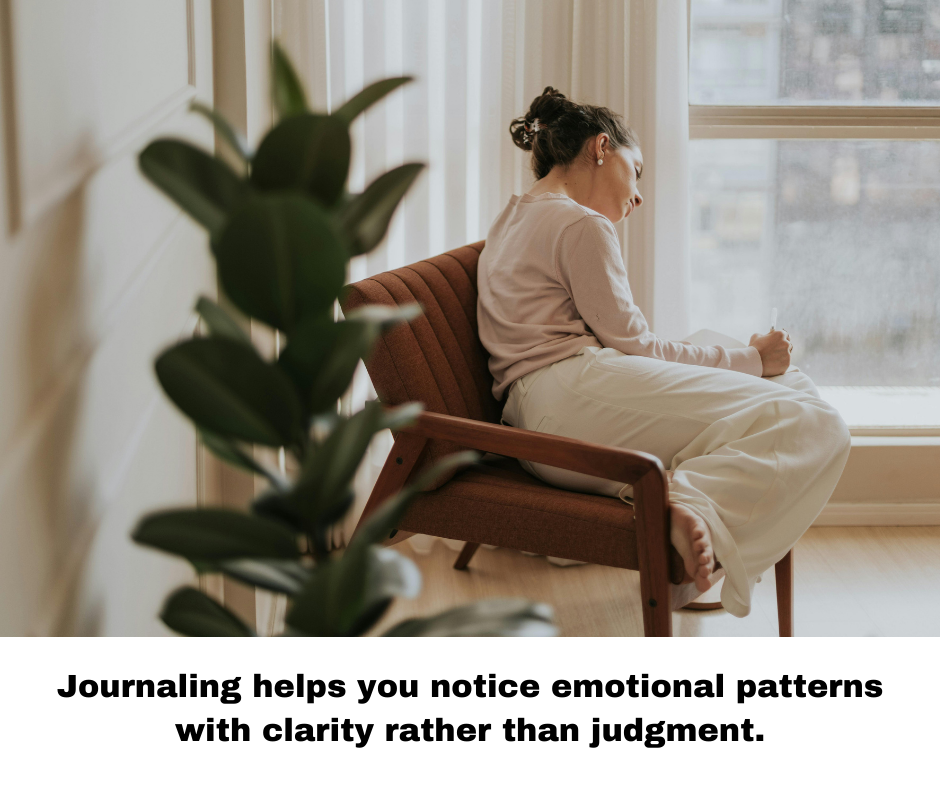 woman journaling sitting at window healing emotionally