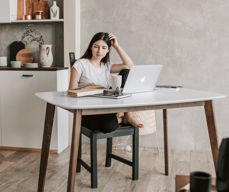 woman sitting at desk self-trust confident leader