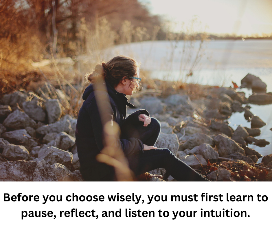 Woman sitting at the lake reflection