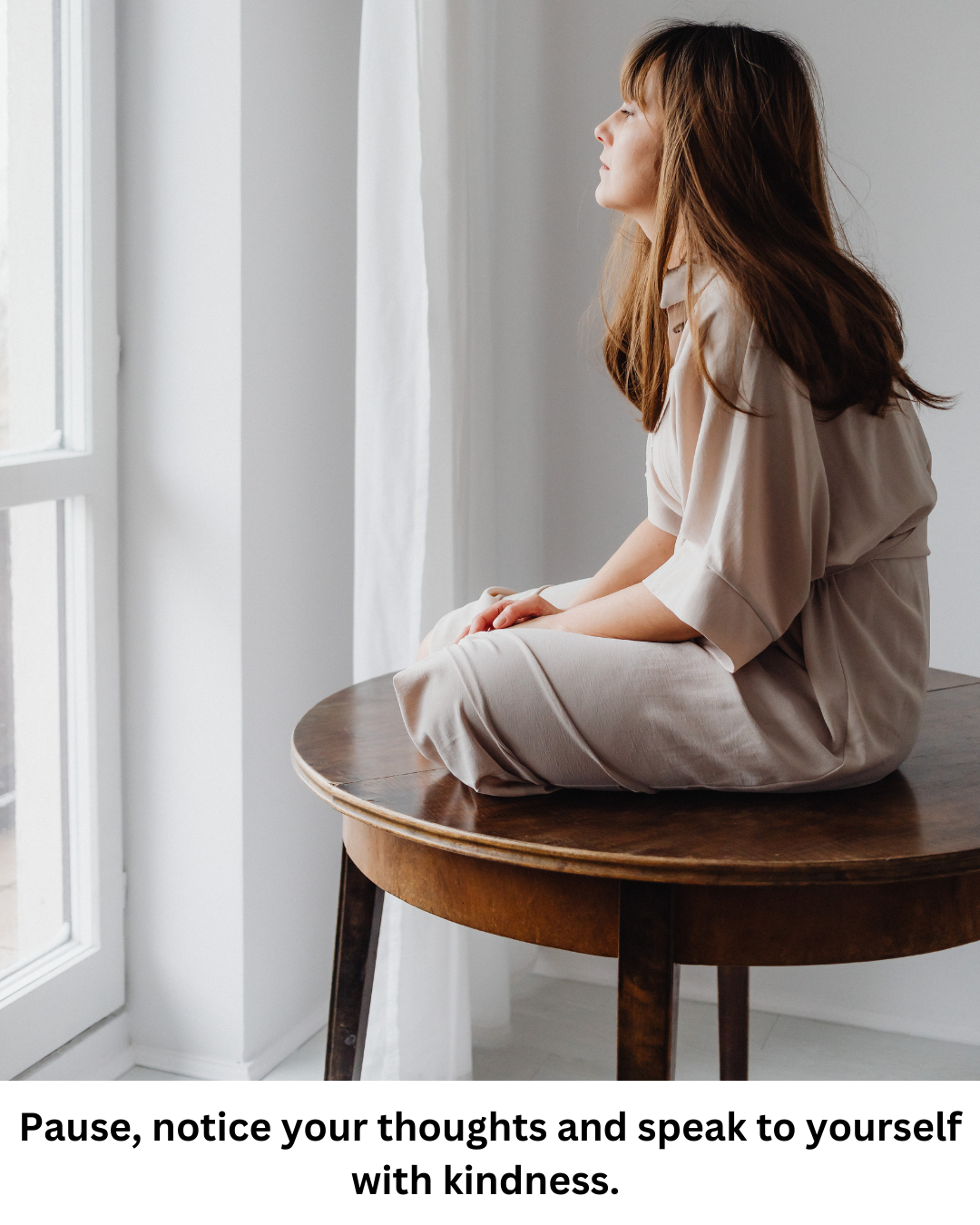 Woman sitting by window words of kindness