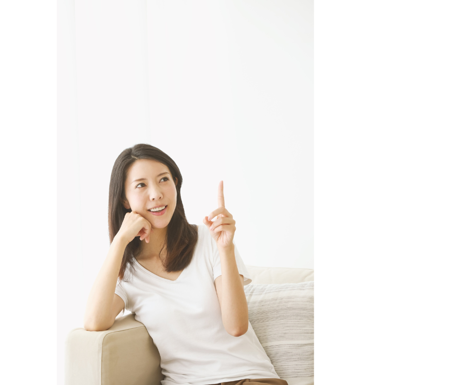 woman smiling pointing up