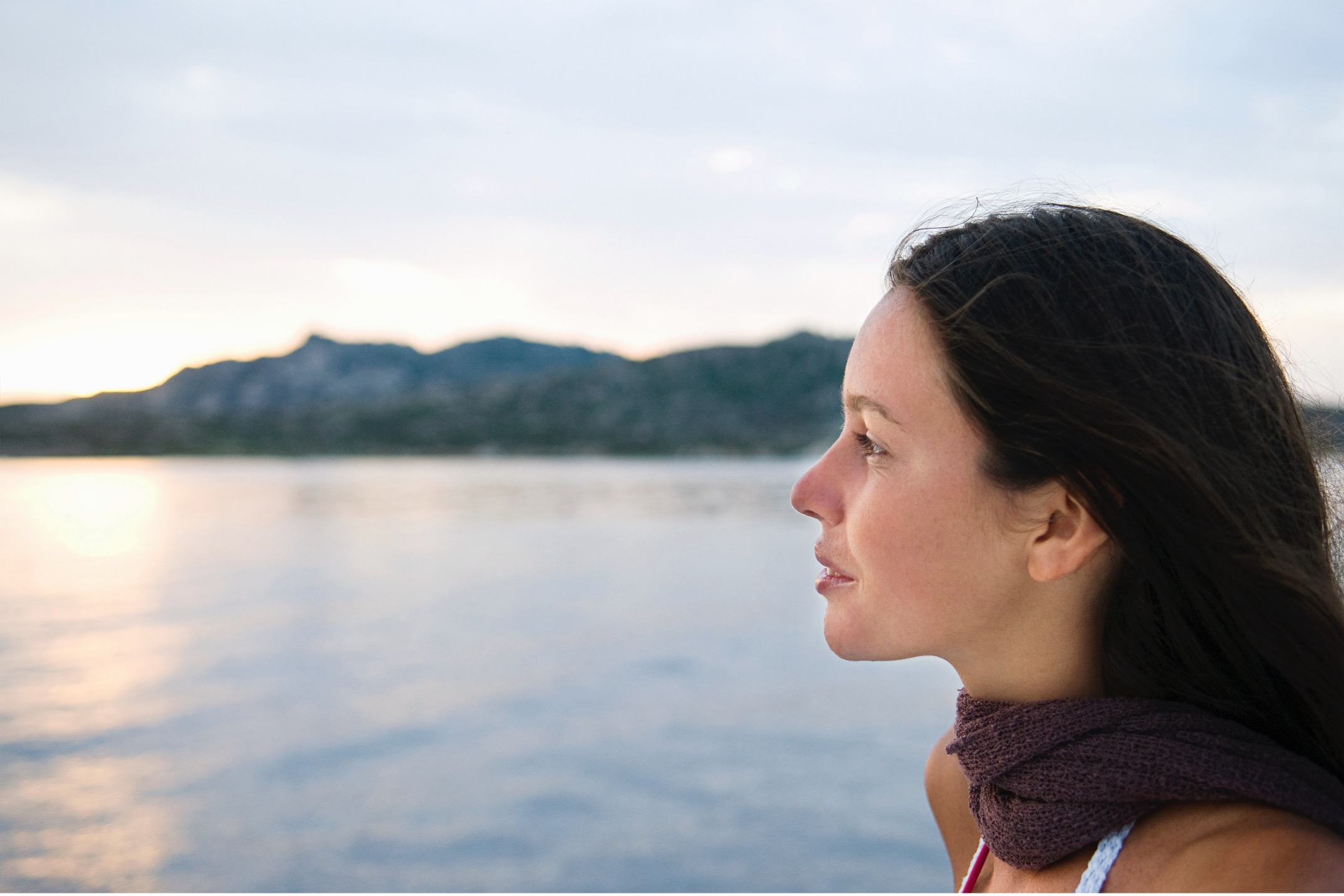 woman thinking at the lake